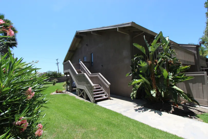 A sunny morning at Casitas Del Sol with a beautiful house and a huge backyard.