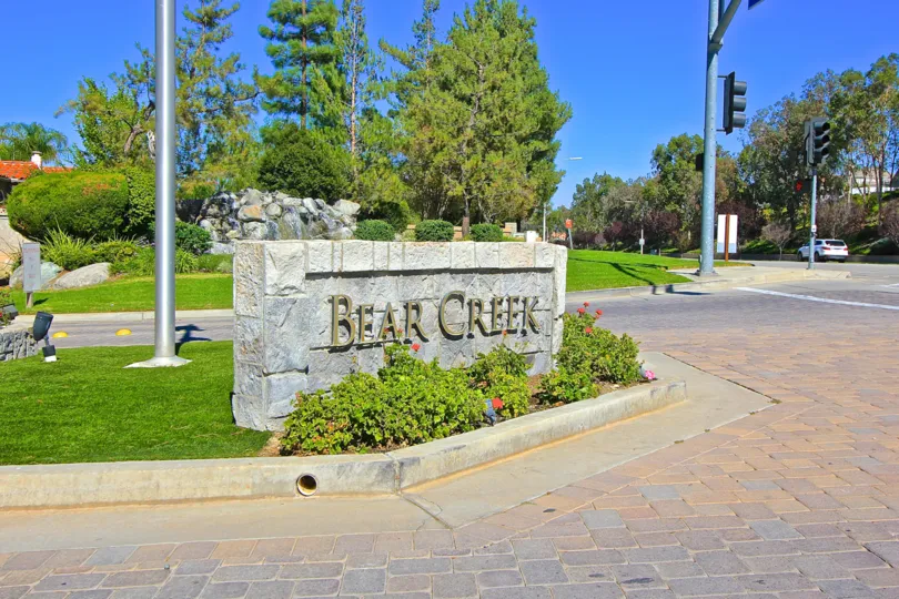 Great Greenery and the Front sign of Country Club Villas at Bear Creek
