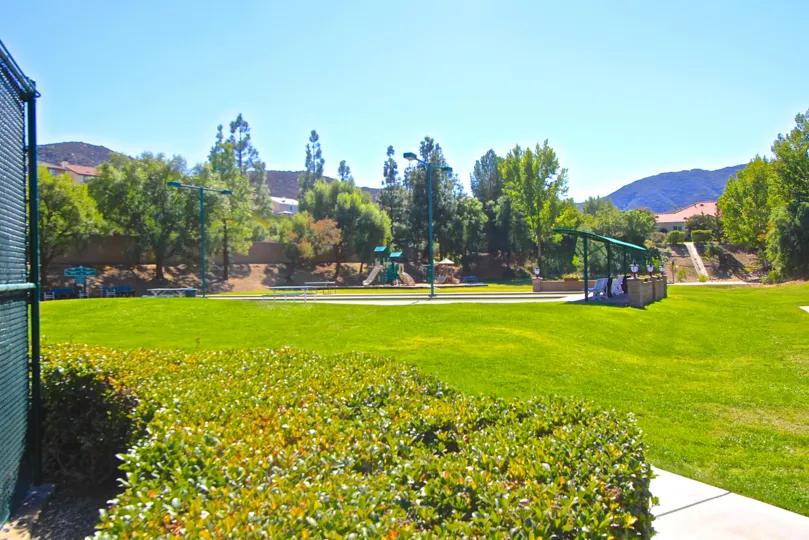 Country Club Villas at Bear Creek has nice trees and quaint playground.