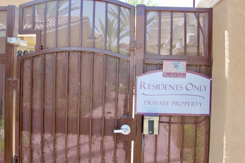 Brown gate with "Residents Only, Private Property" to the North Oaks section of Murrieta, California