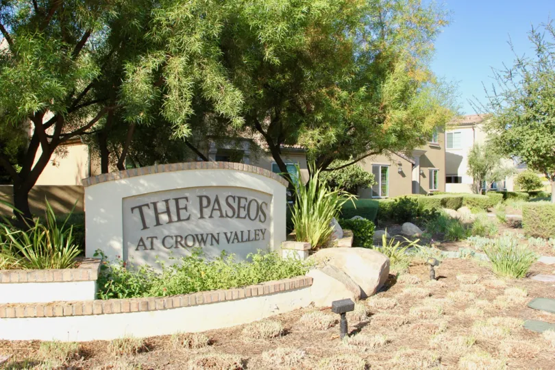 The Front Public view of The Paseos at Crown Valley with trees and nice landscaping