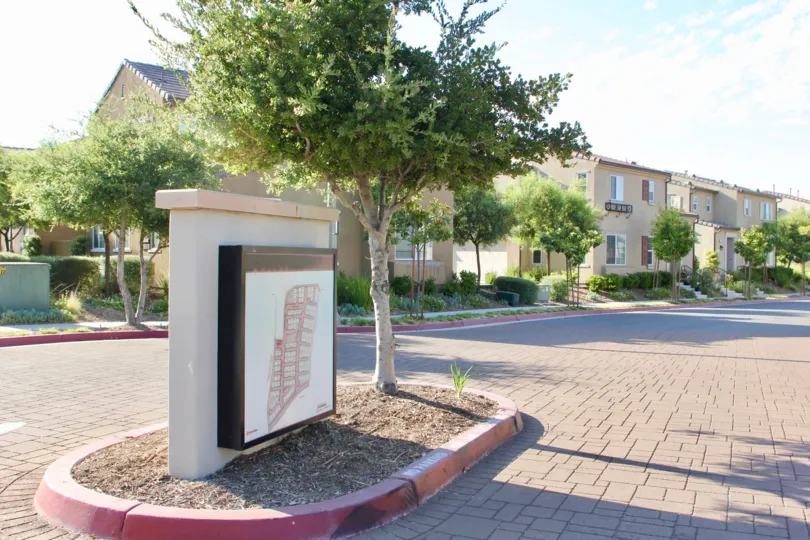 A red map of the community sits on a sign board at Paseos at Crown Valley.