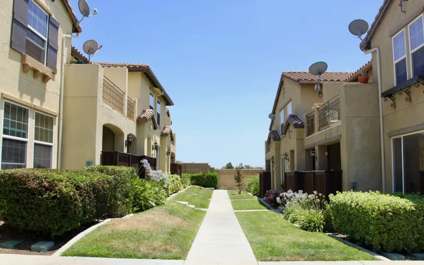 four dish antenna are placed on each house at the top of roof and door is placed for window