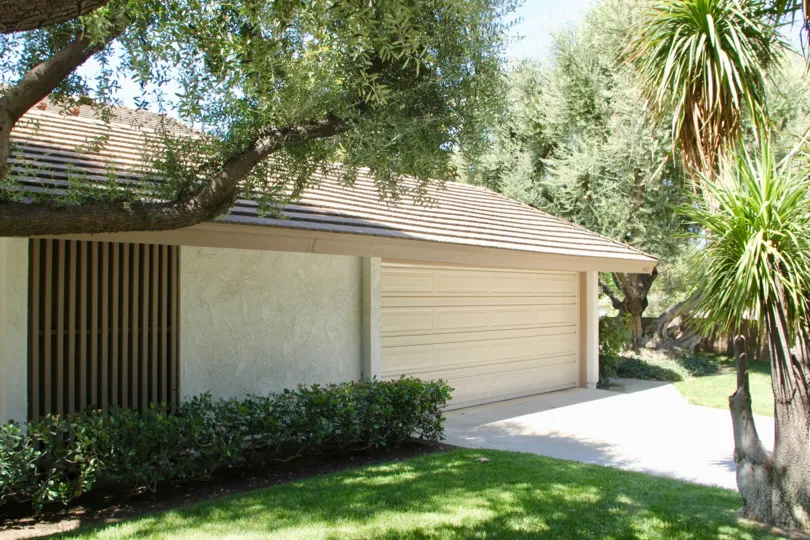 Brown slats cover a window on a house at Canyon Crest Villas.