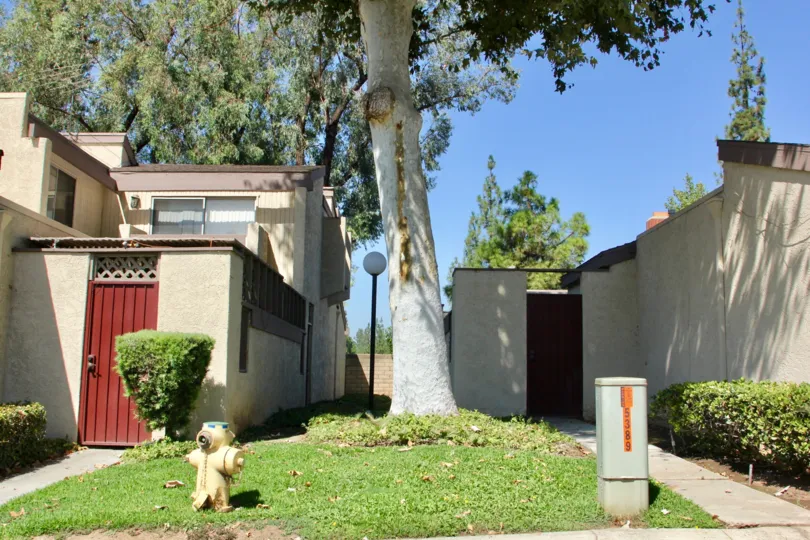 Grassy Yard dividing Units in Crest View Estates showing proximity of fire hydrant