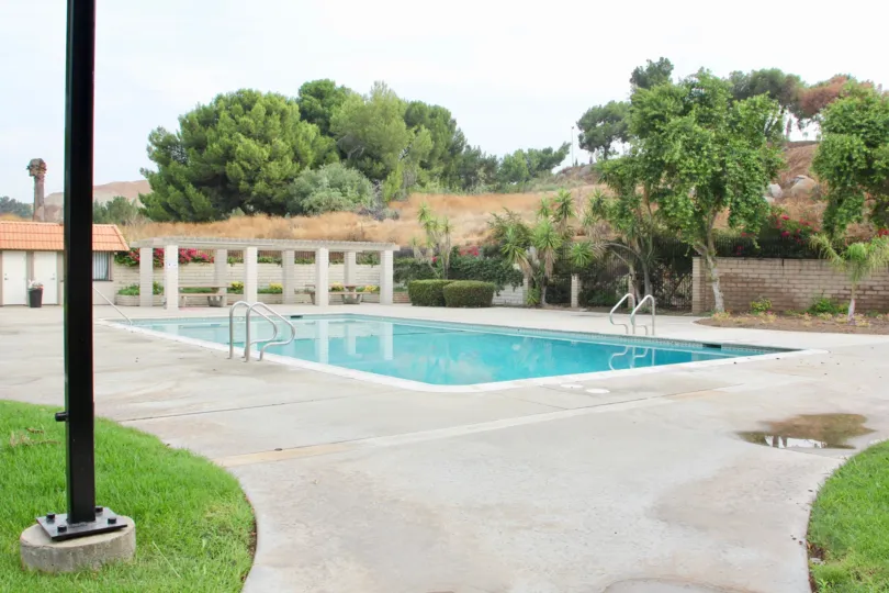 A puddle sits on a path in the community area at the De Anza Verde community.