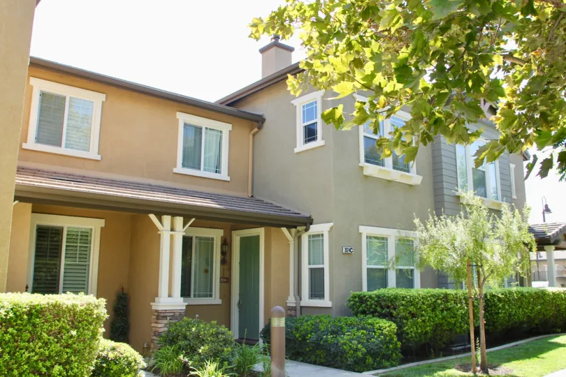 Multi-level houses in brown and gray in Georgetown Square community.