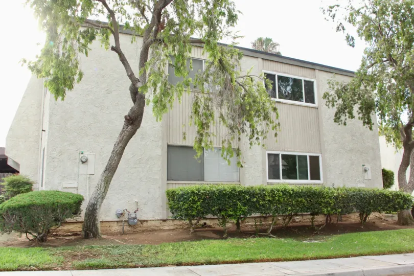 A building of the Jurupa Hills Country Club and its landscaping on a cloudy day