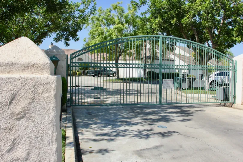 The outer entrance gate at Victoria Fairways located in Riverside, California. It is a beautiful sunny day.