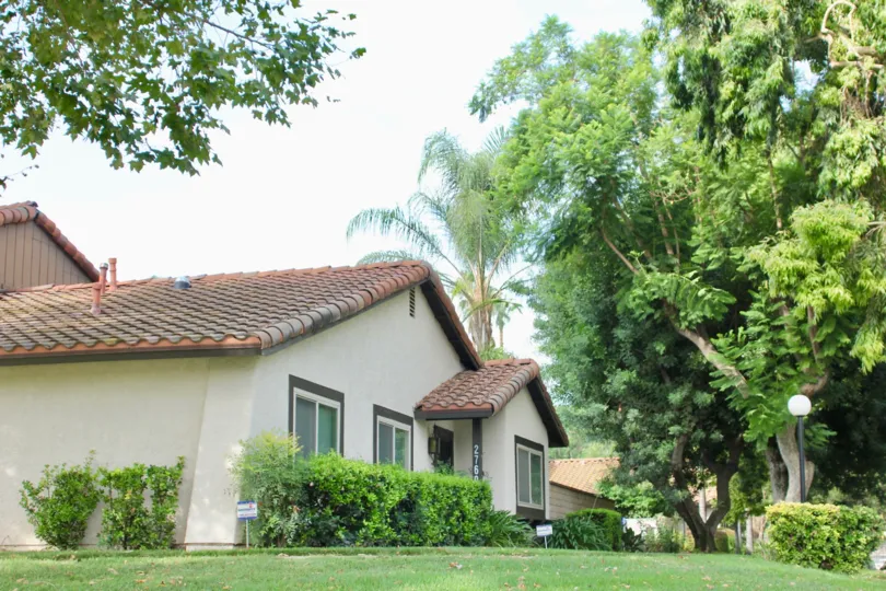 single story apartments with grassy area at Victoria Village