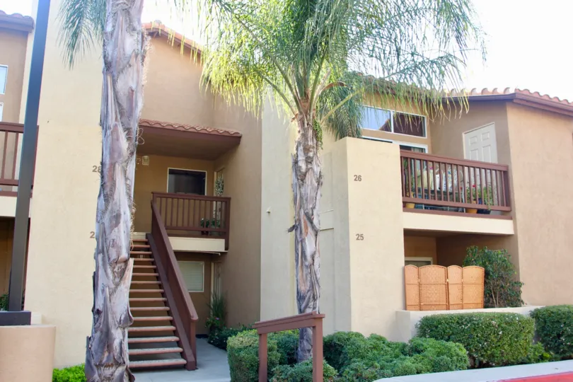 Palm Valley Condos temecula California fine shaped cute buiding with numbers at front, balcony and stairs painted brown