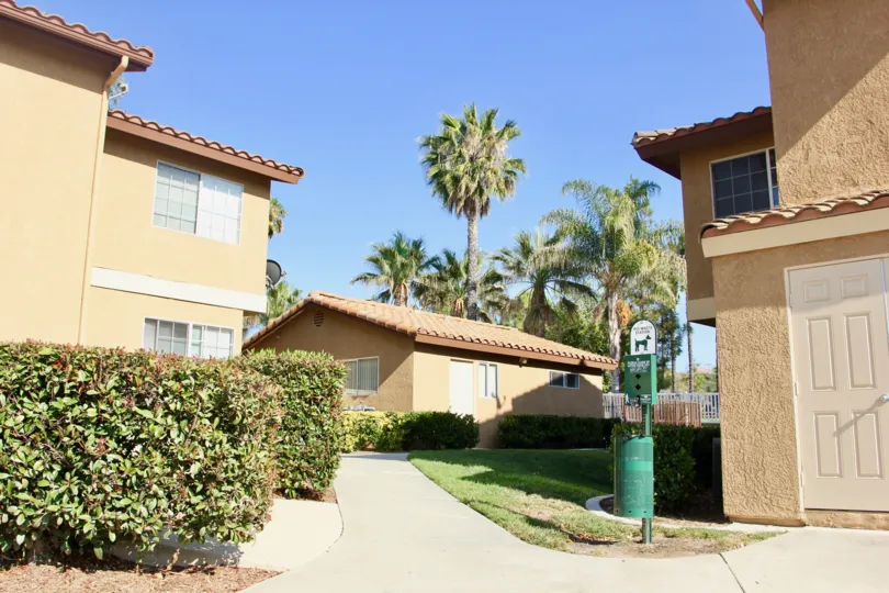 In Palm valley condos, a beautiful view of buildings and sky high trees