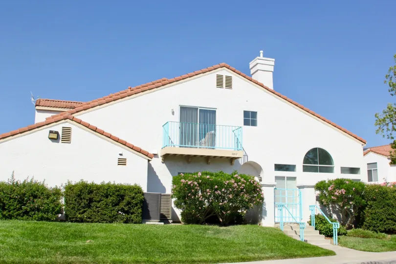 Rancho Del Mar temecula California triangle shaped house with nice chimney, blue stair structure in front