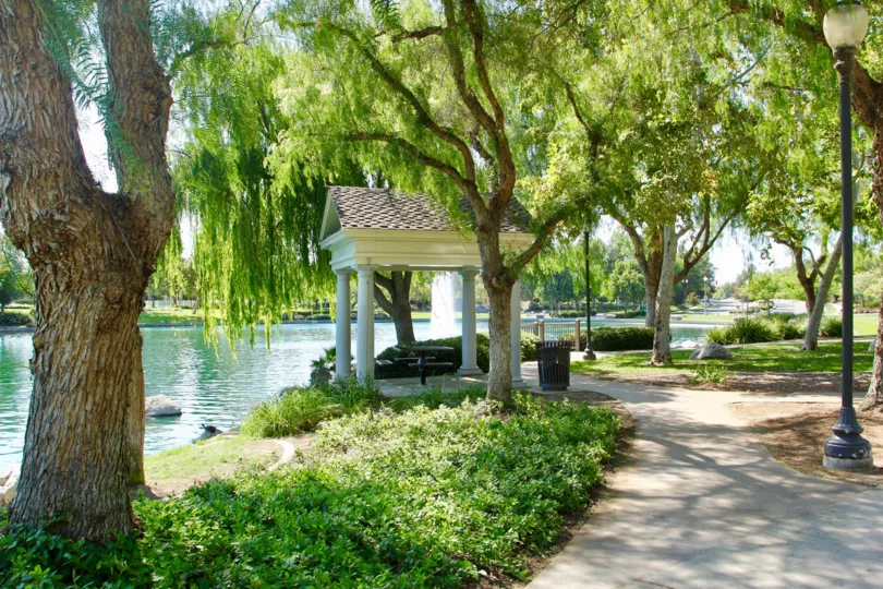 Vista lakeside fountain view pathways walk in the tree gardens. A picnic table and Patagonia