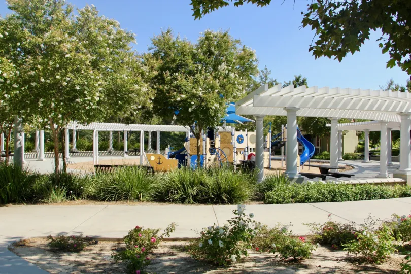 Children's play area surrounded by gazebos at Savannah at Harveston in Temecula, California