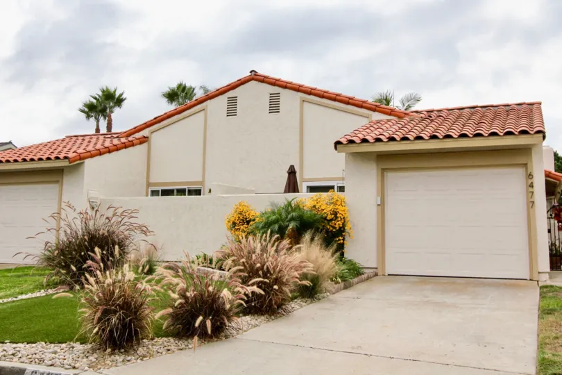 A sunny day in the area of Alta Mira, garage, driveway, palm trees, condos