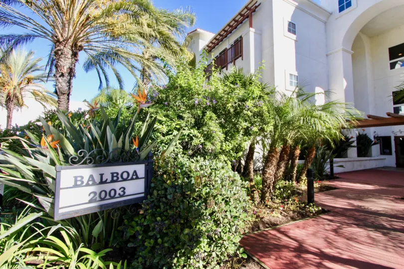 A traditional townhomes with white walls and red paving in the Balboa Building.