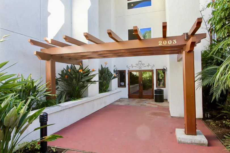 THE 2003 BUILDING IN THE BALBOA BUILDING WITH THE BLACK COLOUR TANK, FLOWER PLANTS, TREES, GLASS DOOR