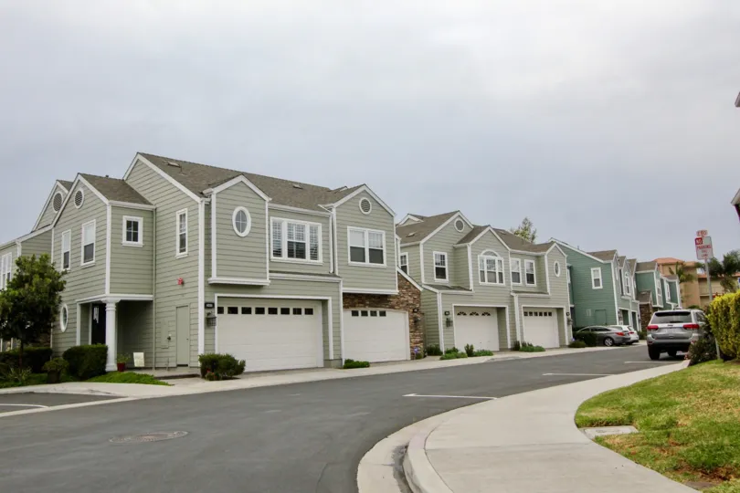 Two-storey townhouses with wooden cladding in the Bayshore neighborhood.