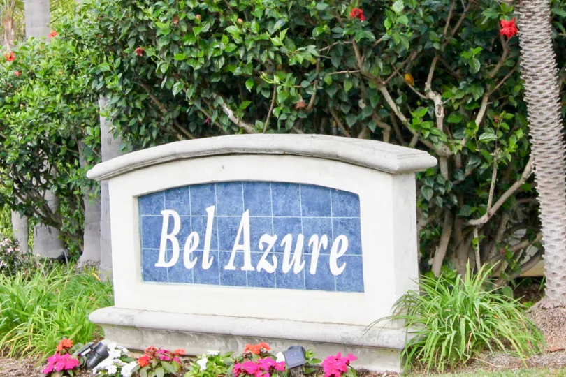 THE GARDEN IN THE BEL AZURE WITH THE BEL AZURE WALL, FLOWER PLANTS, TREES