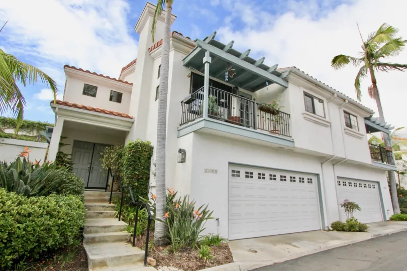 Wide shot of the front of a home in Bel Azure of Carlsbad California