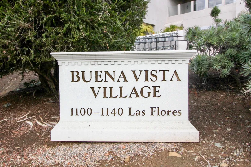 Sign in front of trees in the Buena Vista Village Community in Carlsbad, CA