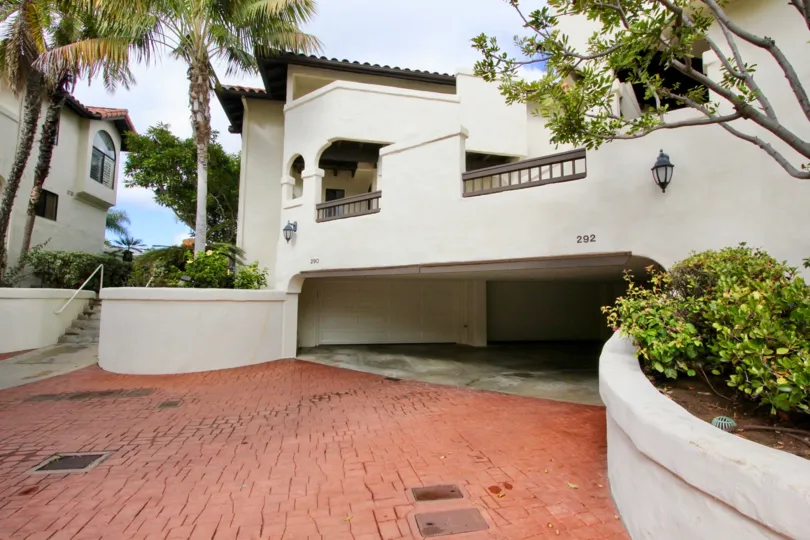 An in-community look at Carlsbad Beach Villas expansive walkway and apartments.