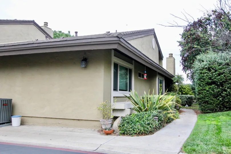 Side of home and greenbelt in Carlsbad Palisades community in Carlsbad, CA