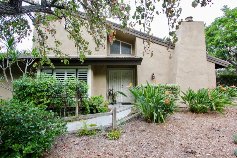A great day in the Carlsbad Palisades with a house and flowers.