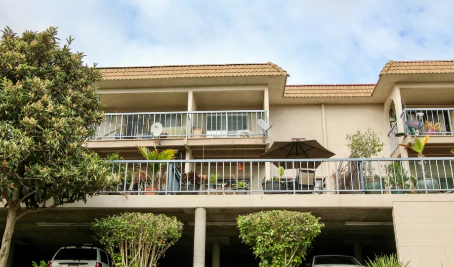 THE APARTMENT IN THE CASA GRANDE WITH THE CAR PARKING, UMBRELLA, BALCONIS, DISH ANTENNAS, PLANTS, TREES, TABLES