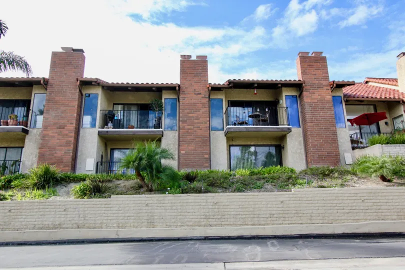 Three duplex homes divided by brick chimneys in Carlsbad