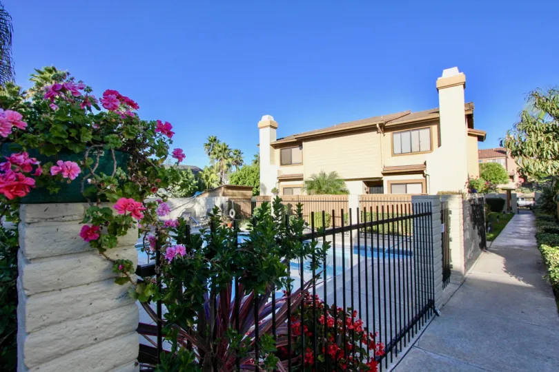 Exrtraordinary view of a villa with flower plants on a sunny day in Centella Meadows of Carlsbad