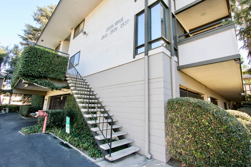 A sunny day in the Costa Verde with aCarlsbad building and staircase.