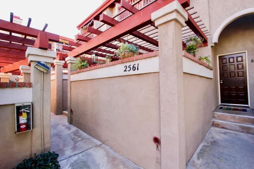 THE 2561 APARTMENT IN THE FAIRWAYS SOUTH WITH THE FIRESAFETY, [LANTS, FLOWER POTS, WOODEN DOOR