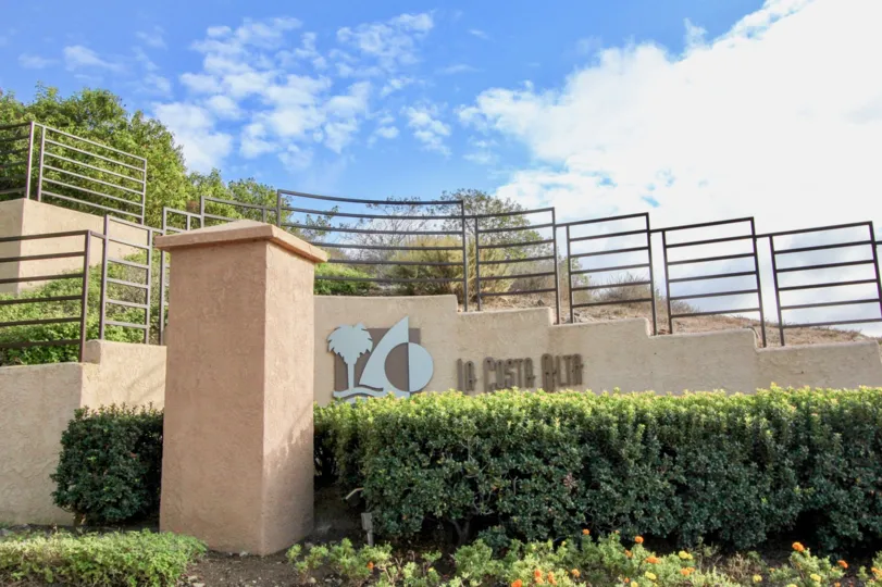 In Wall mentioned the Community name as La Costa Alta with logo back to the bushes