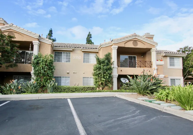 THE 3110 APARTMENT IN THE LA COSTA ALTA WITH THE BALCONI, PLANTS, TREES, DISH ANTENNA