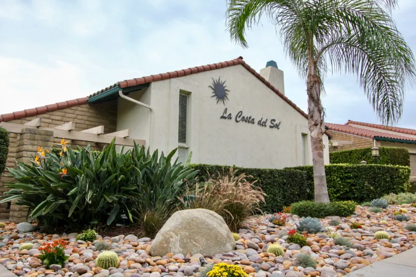 THE BUILDING IN THE LA COSTA DEL SOL WITH THE ROCKS, STONES, TREES, PLANTS