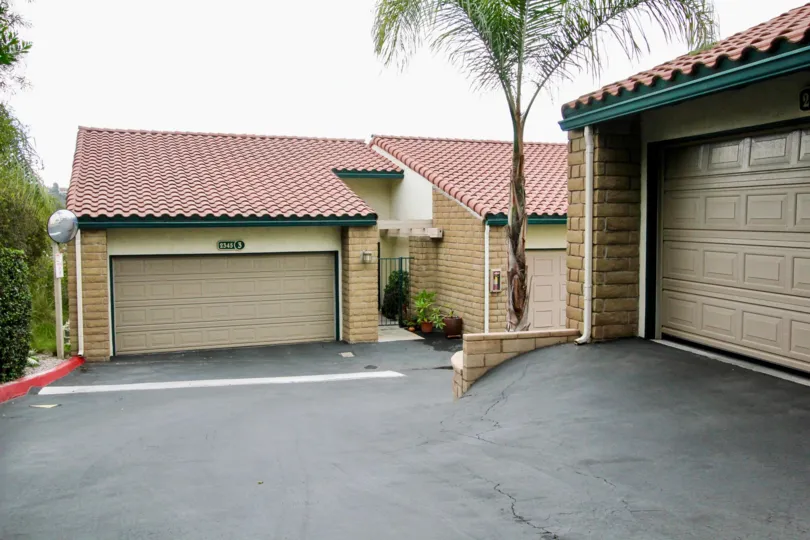 Condominiums with garages on an overcast day in the community of La Costa Del Sol in Carlsbad CA