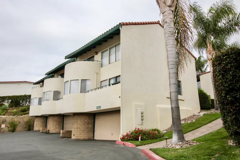 Rounded building with garages at bottom in La Costa Del Sol community, Carlsbad, CA
