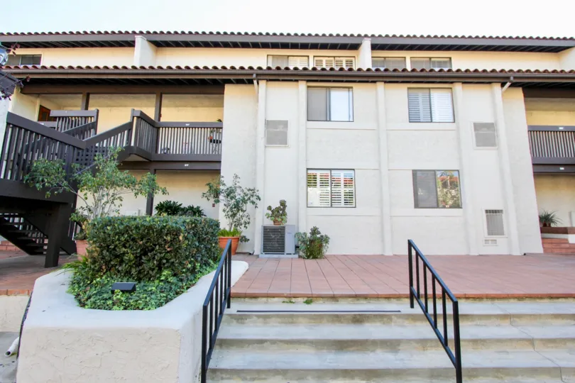 THE ESTATE IN THE LA COSTA RIVIERA WITH THE STEPS, PLANTS, BALCONIS, FLOWER POT