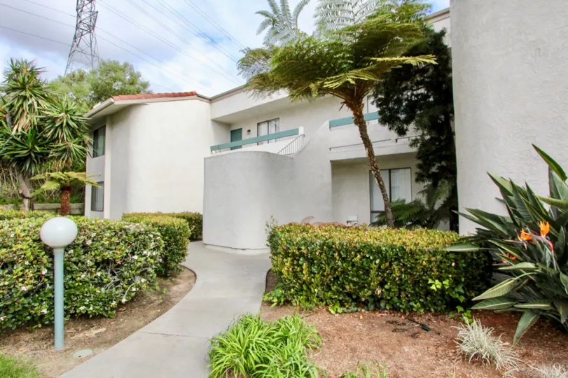 THE HOME IN THE LA COSTA VIEW WITH THE PLANTS, TREES, BULP