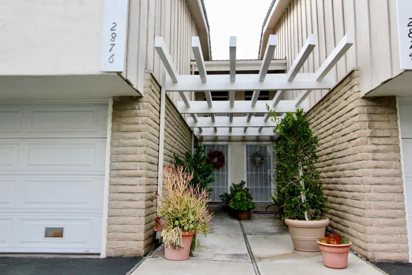 THE 2876 APARTMENT IN THE MEADOW VILLAS WITH THE SHUTTER, PLANTS, TREES