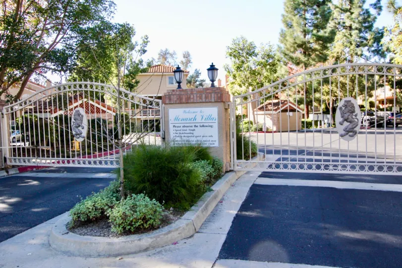 THE BEAUTIFUL APARTMENT IN THE MONARCH VILLAS WITH THE PLANTS, TREES, STEEL GATE