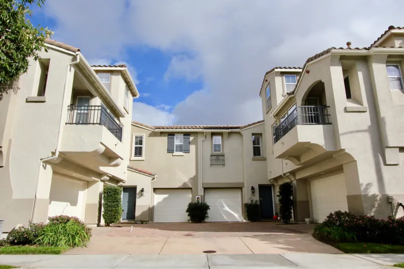 a sunny day in the mystic point with house that has glass window and close parking door