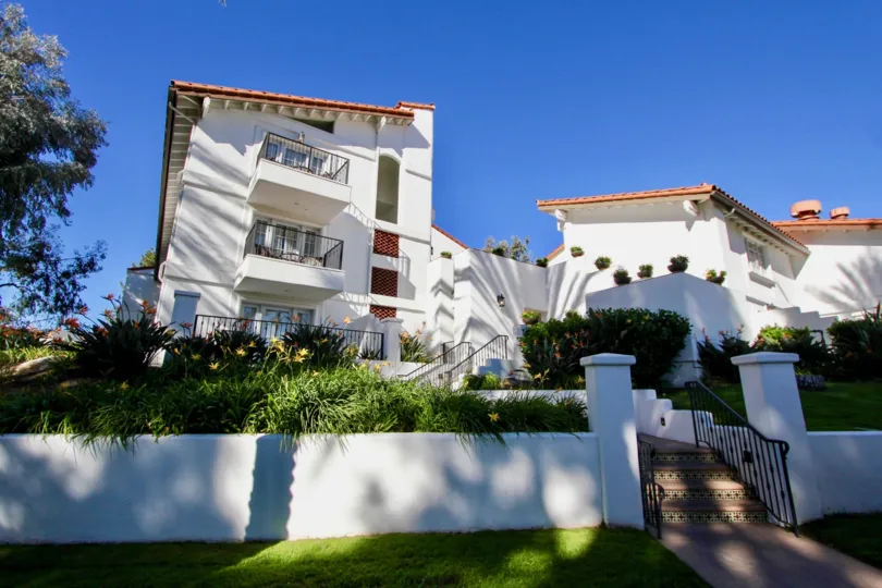 A beautiful day in the Omni La Costa Resort & Spa with a house and garden.