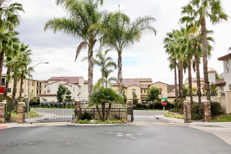 A two driveway entrance leading to the Poinsettia Heights in Carlsbad CA