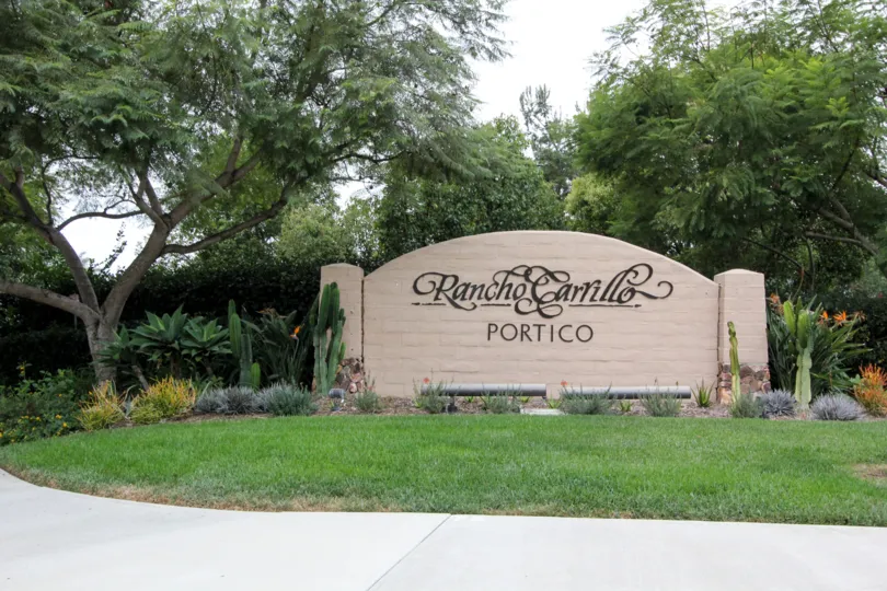 A SUNNY DAY IN THE PORTICO WITH THE RANCHOGARRILLO PORTICO BOARD, PLANTS, TREES