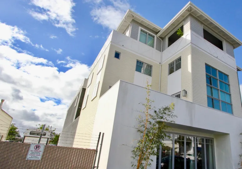 Nice Building with sunshine and entrance gate with glass doors in Railyard Loft of Carlsbad
