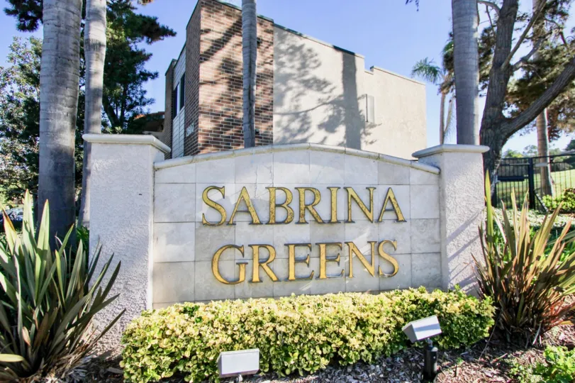 Nice villa with signboard and trees on a sunny day in Sabrina Greens of Carlsbad