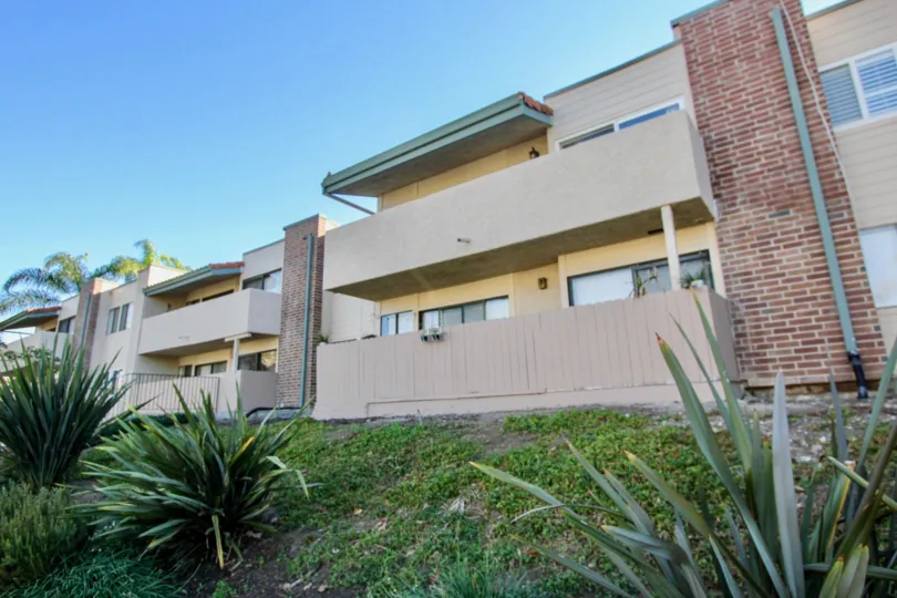Backside to the Apartment in Sabrina Greens has pipe with bushes and meadows